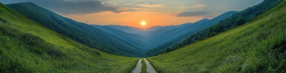 Obraz premium The sun is setting over a mountain range, casting a warm glow over the landscape