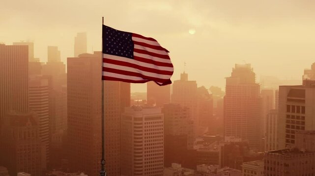 Aerial Drone Shot of American Flag Waving at Sunrise Over San Francisco Skyline and Nob Hill, California