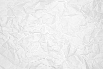 Crumpled white paper background creating texture pattern.