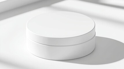 A minimalist white circular container on a light surface, showcasing simplicity and elegance.