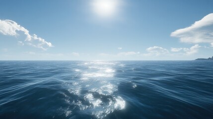 Fototapeta premium A clear blue ocean with gentle waves under a bright, cloudless sky, offering a classic summer feel.