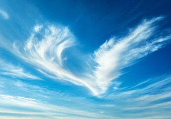 A single, fluffy heart-shaped cloud floats against a vivid blue sky, evoking themes of love, romance, and serenity.