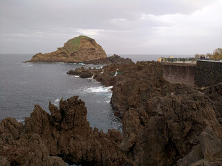 View of the island ‘Snail Rock’ on the coast of Porto Moniz on the island of Madiera (Portugal)