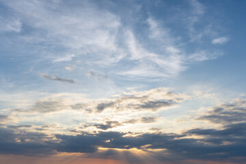 Beautiful morning or evening blue and orange or yellow sky with cloudy while sunsets or sunrises taken at the sea used as natural blackground texture