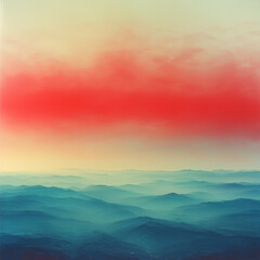 Obraz premium Red sky sunset over misty blue mountain range aerial view for backgrounds