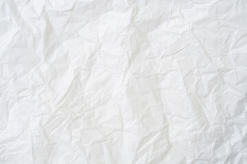 Top view and full frame of wrinkled or crumpled white stencil paper texture used for wrinkled or...