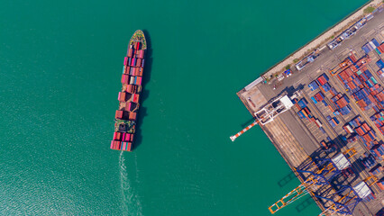 Industrial import-export port prepare to load containers. Aerial top view container ship in export...