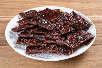 angle view beef jerky on wood background