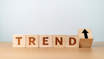 Wooden blocks spelling 'TREND' with an upward arrow symbol.