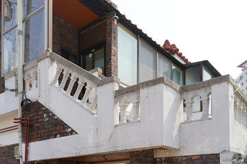 Railings on rooftops or staircases that prevent falls and assist movement. Functional and safety-oriented design.