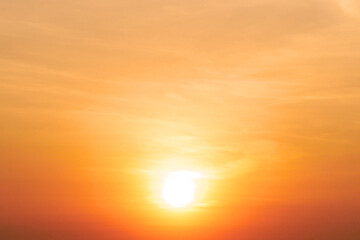 Stunning Golden Sunset with Vibrant Orange and Yellow Sky Over Horizon Capturing the Beauty of Nature's Evening Glow