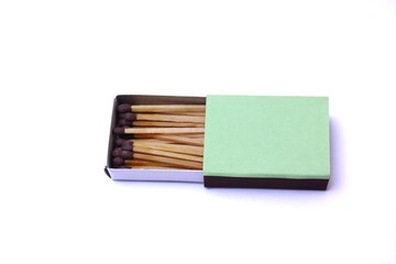 Fototapeta premium Open Matchbox With Wooden Matches on a White Background