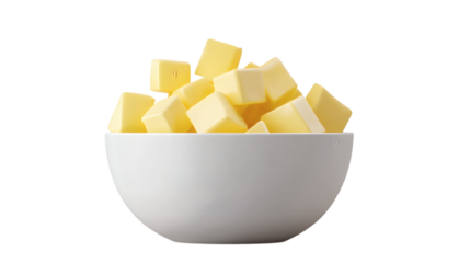 cubes of fresh yellow butter in white ceramic bowl isolated on white transparent background