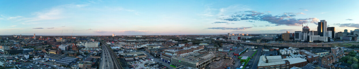 Obraz premium High Angle Ultra Wide Panoramic View of Buildings at Downtown Central Birmingham City of England United Kingdom During Sunset. Aerial View of Was Captured with Drone's Camera on March 30th, 2024
