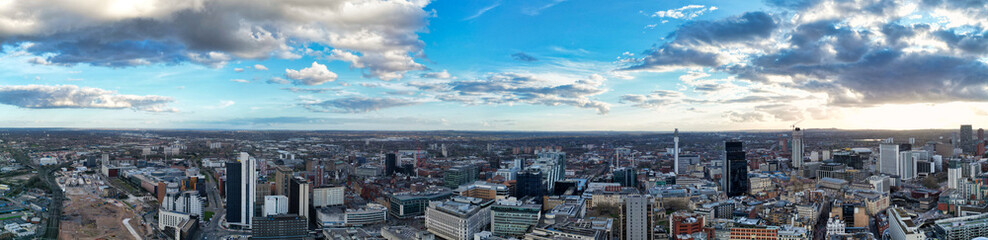 Obraz premium High Angle Ultra Wide Panoramic View of Buildings at Downtown Central Birmingham City of England United Kingdom During Sunset. Aerial View of Was Captured with Drone's Camera on March 30th, 2024