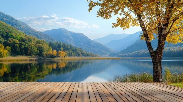 A photostock of a wooden deck overlooking a tranquil lake surrounded by mountains