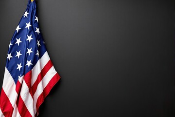Fototapeta premium United States flag with stars and stripes hanging on a dark textured background, providing a patriotic and solemn concept. Ai generative