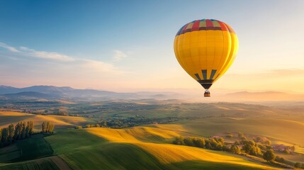 Fototapeta premium Vibrant Hot Air Balloon Gliding Over Scenic Hills and Fields at Sunrise, Capturing the Beauty of Nature and the Joy of Adventure in Open Landscapes