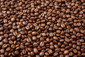 Obraz premium Close-up of roasted coffee beans with a glossy brown surface, forming a textured pattern. Warm tones, natural background, concept of coffee aroma. Ai generative