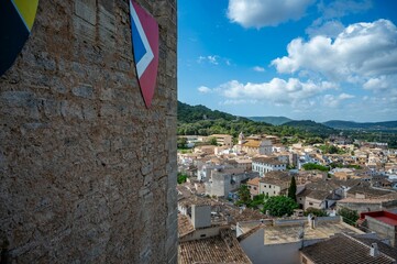 Scenic view of a historic town with traditional buildings and landscape.