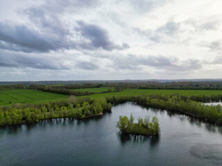 Aerial View of Bedford City of Bedfordshire, England United Kingdom During Windy and Mostly Cloudy Day. High Angle Footage Was Captured with Drone's Camera on April 5th, 2024 from Medium High Altitude