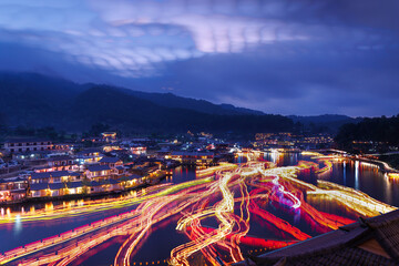 Ban Rak Thai Village at night scene, over colorful lighting and beautiful decorative lamps, motion...
