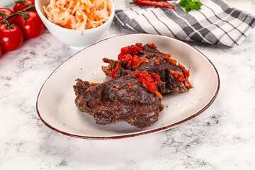 Baked beef cheeks with vegetables