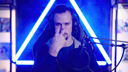 Male gaming streamer angry looking at you pointing with fingers
