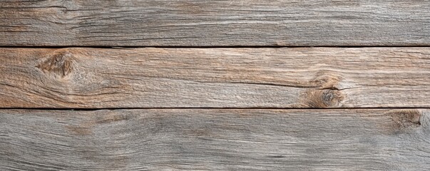 Obraz premium A close-up view of rustic wooden planks, showcasing their natural texture and color variations, perfect for backgrounds or design elements.