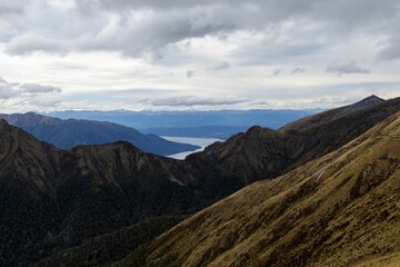 Mountainous landscape with distant lake view.