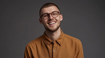Fototapeta premium Smiling Young Man in Casual Attire with Glasses