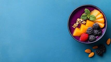 Delicious smoothie bowl with berries, mango, and granola.