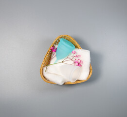 Menstrual cups in two colors, on a grey background, Eco-Friendly alternate to sanitary pads