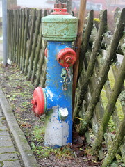 colorful fire hydrant in the street. Creative color design makes this technical object eye-catching and attractive for urban design concepts and planning.