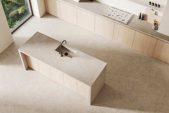 Minimalist kitchen interior with beige stone countertops and wooden cabinets, featuring a central island with a black faucet and natural light. 3D Rendering