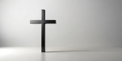 Naklejka premium Clean, minimalist design: a black cross on white, ideal for religious projects needing a subtle yet impactful image.