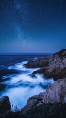 Obraz premium Starry Night Over Rugged Coastline