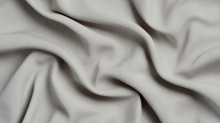 Fototapeta premium A close-up of smooth, wrinkled fabric in neutral tones.