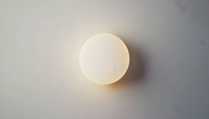 Modern minimalist round wall lamp, glowing softly against a neutral background. Perfect for interior design, home decor, and architectural photography.