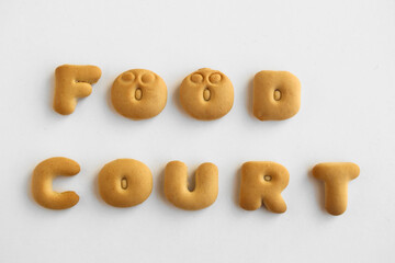 set of Bakery alphabet. words made from letters for holiday decor. cookie bisquit font alphabet. FOOD COURT - word made from letters isolated on white background. crackers in the form of food court