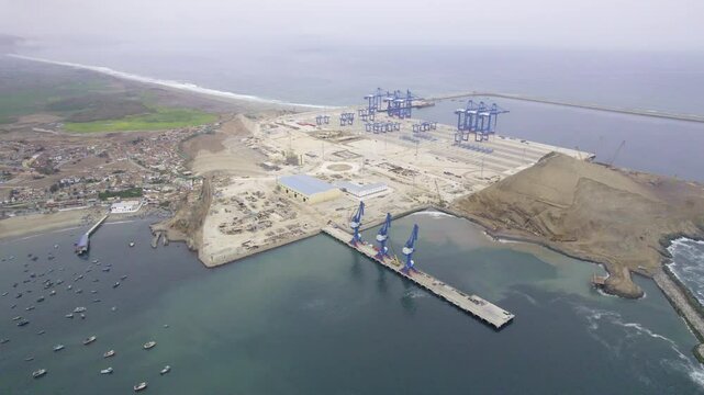 Chancay mega port. A blue sky with a large body of water and a large port. Peru
