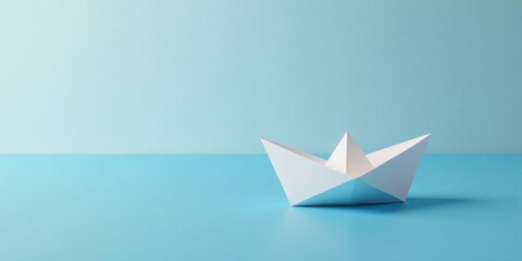 A Simple White Origami Boat on a Calm Blue Surface