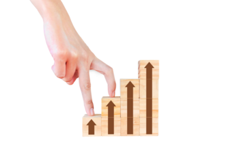 Fingers placed on wooden blocks symbolizing walking up stairs to reach the goal, isolated on white background. Business concept for successful growth process. PNG