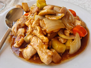 A plate of chicken with almonds