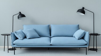 Light blue sofa in modern living room with floor lamps and side tables.
