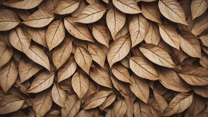 Textured arrangement of dry leaves in warm brown tones creating a rustic and organic appearance