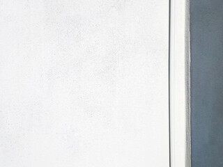 Minimalist style photo of white wall background with gray border and drain pipe makes the photo look beautiful, simple and unique with space for text.