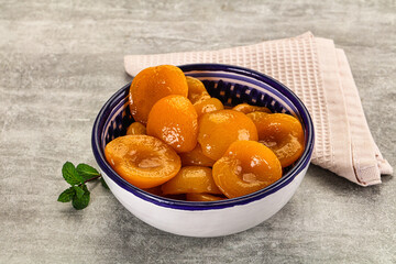 Sweet canned apricots with syrope