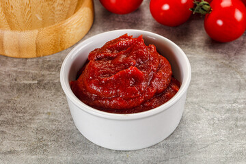 Red tomato paste in the bowl