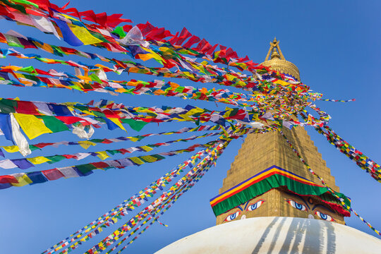 Colorful prayer flags on to the Boudhanath stupa in Kathmandu, Nepal